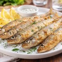 Панированная рыбка с лимоном и зеленью